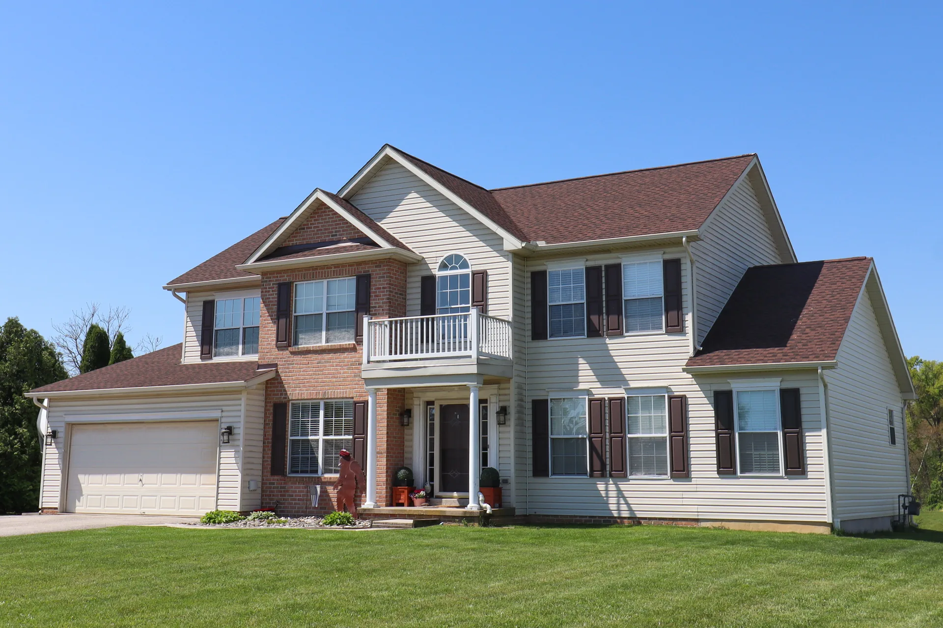Completed roof on a two-story home with a Juliet balcony in York County, PA by Cool Water Roofing